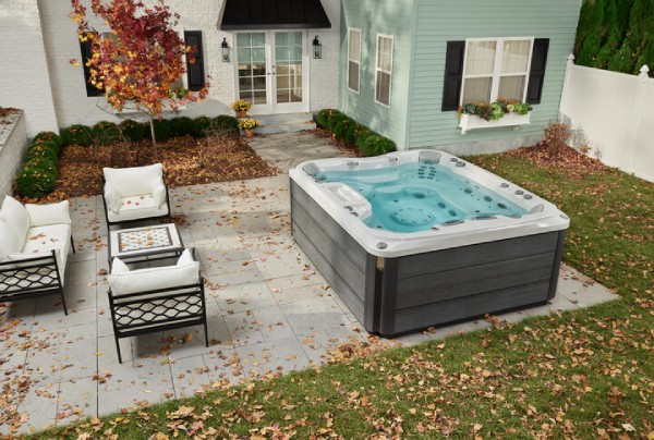 large hot tubs - sundance spa in backyard during fall 
